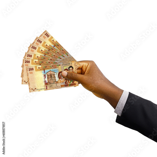 Black hand with suit holding 3D rendered Bolivian boliviano notes isolated on transparent background photo