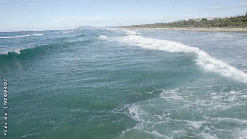 Waves Breaking At Lighthouse Beach In Port Macquarie, NSW, Australia - drone shot Waves Breaking At Lighthouse Beach In Port Macquarie, NSW, Australia - drone shot