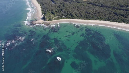 Turquoise Seascape In Wenonah Head Peninsula, Urunga, NSW, Australia - aerial drone shot photo