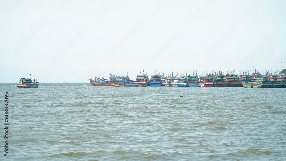 Many traditional fishing boats dock at the harbor on the north coast of Java, Indonesia