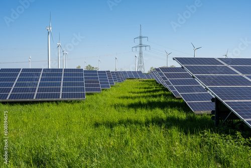 Solar panels, wind turbines and electricity pylons seen in Germany photo
