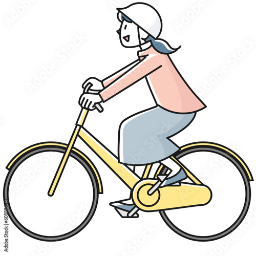 ヘルメットを着けて自転車に乗っている若い女性