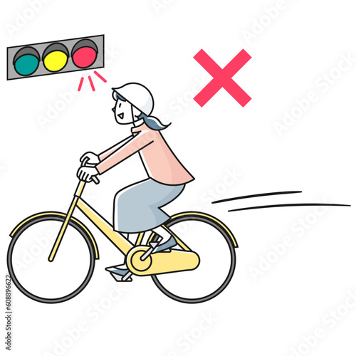 信号を無視して自転車で走る若い女性