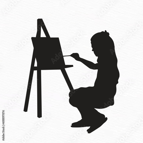 silhouette of a little young girl painting outdoor. canvas on easel 