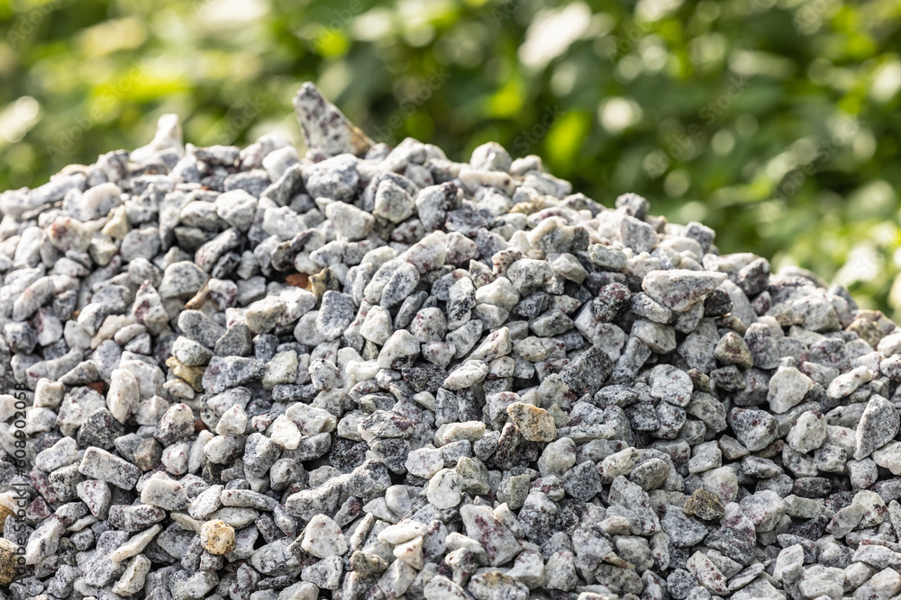 Crushed rock. Small rocks ground. Crushed stone road building