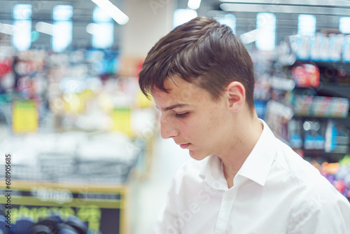 portrait of a handsome teenager in a shopping mall