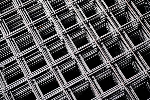 Stacked welded wire mesh in cold plant storehouse macro view photo