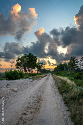 Bicycle route r-10. Spit on Lake Kopan. Baltic Sea. Sunrise. Darlowo, Poland photo
