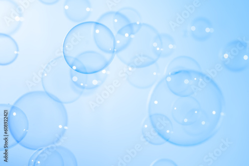 Beautiful Transparent A Blue Soap Bubbles. Abstract Background. Celebration Festive Backdrop. Freshness Soap Suds Bubbles Water  