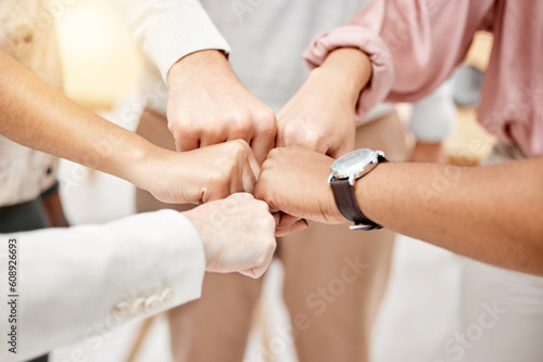 Fist bump, teamwork and group of people for collaboration, challenge and support, team building game or startup goals. Circle of friends with strong, cooperation and integration hands sign for power