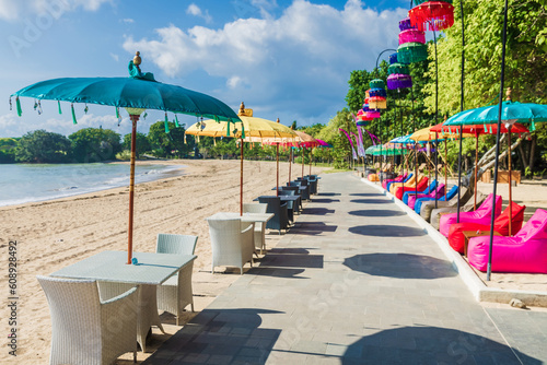 Cafe with colorful umbrellas at beach in Bali, Nusa Dua photo