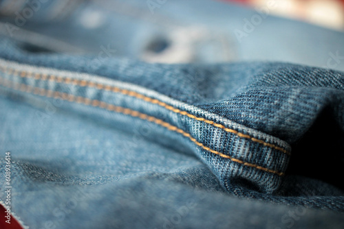 Jeans background, denim with seam of fashion design