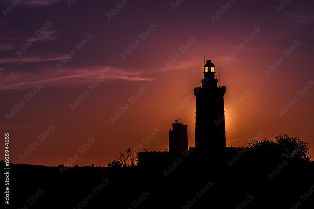 Lighthouse at sunset. Sunset behind the lighthouse of Cap Fréhel, in the Côtes d'Armor in France.