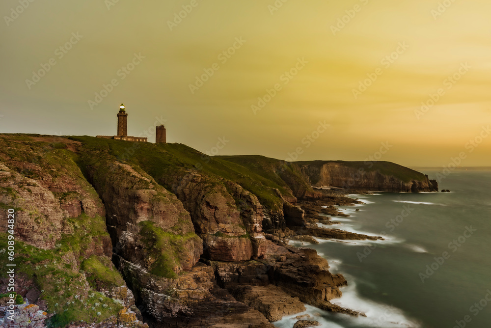 Lighthouse on the coast. Long exposure landscape of the lighthouse of Cap Fréhel, in Brittany, France, at sunset.