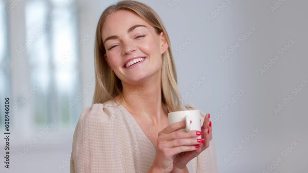 Young woman drinking coffee at home feeling good and having fun, enjoy a cup of coffee looking to one side Young woman drinking coffee at home feeling good and having fun, enjoy a cup of coffee looking to one side