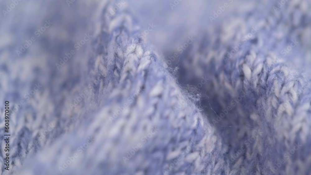 close up rotation of crumpled knitted woolen light blue fluffy fabric, detailed texture, macro shoot. cozy wool blanket, bedspread, knitwear, warm sweater. light blue knitted background. close up rotation of crumpled knitted woolen light blue fluffy fabric, detailed texture, macro shoot. cozy wool blanket, bedspread, knitwear, warm sweater. light blue knitted background.