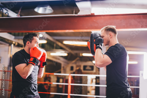 Boxers do boxing training on a gym