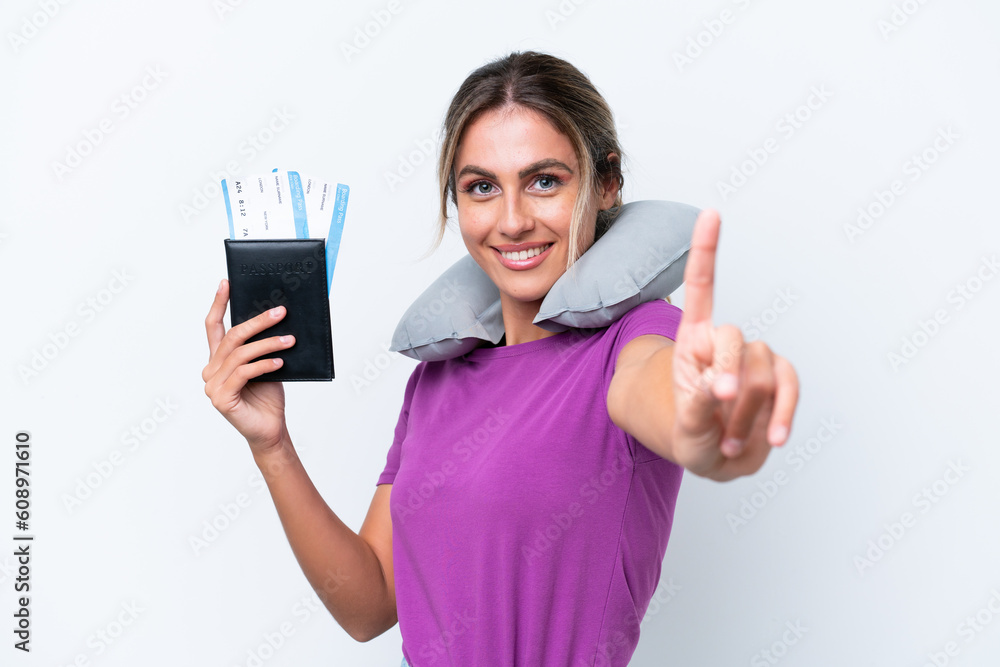Young pretty Uruguayan woman with Inflatable Travel Pillow isolated on white background showing and lifting a finger Young pretty Uruguayan woman with Inflatable Travel Pillow isolated on white background showing and lifting a finger