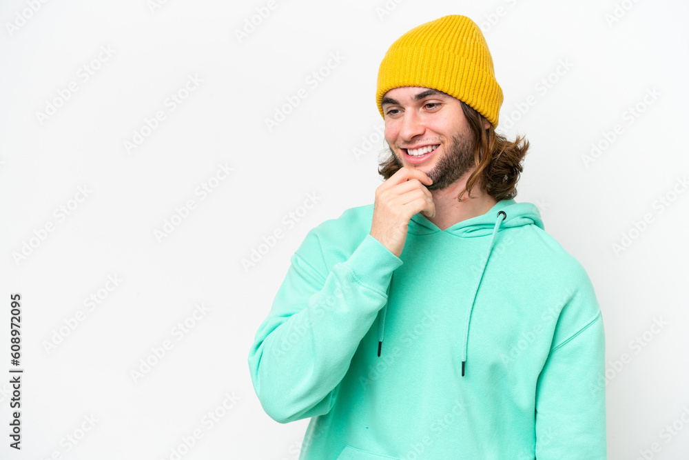 Young handsome man isolated on white chroma background looking to the side Young handsome man isolated on white chroma background looking to the side