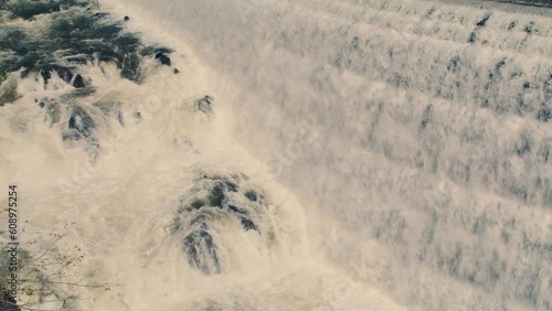 White water rushing down New Croton Dam stepped spillway and gorge waterfall. Static shot, Slow motion 40 fps. photo