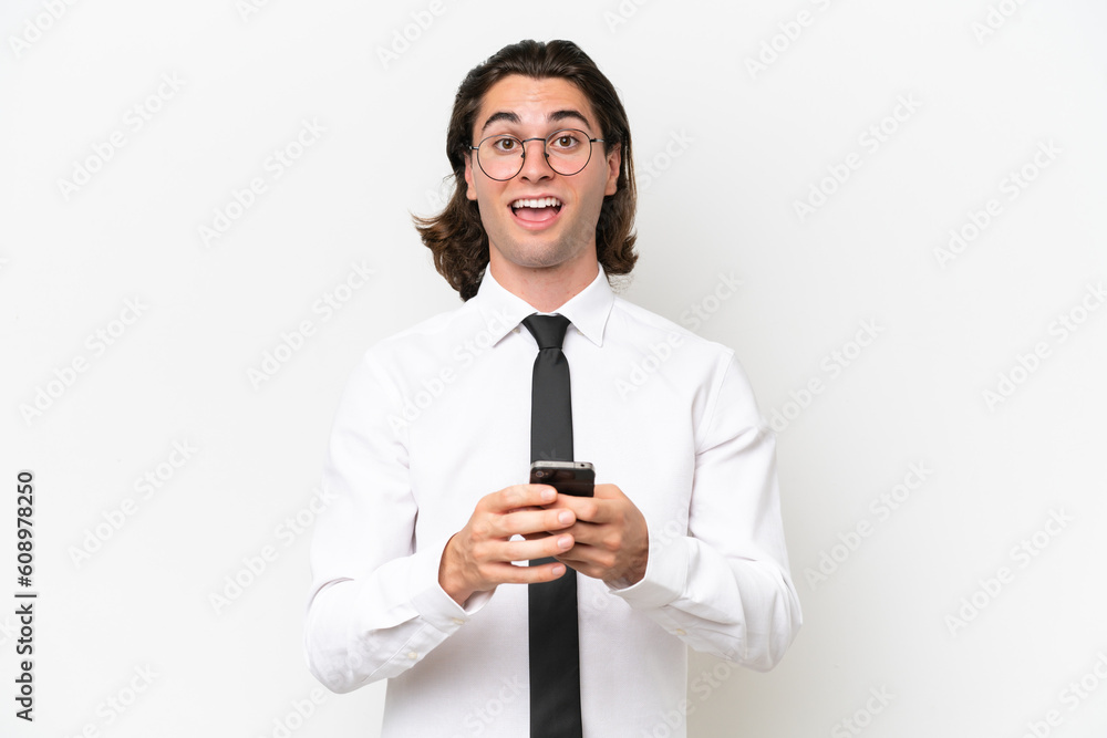 Business handsome man isolated on white background surprised and sending a message Business handsome man isolated on white background surprised and sending a message