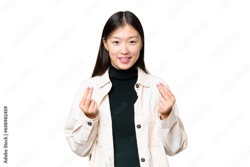 Young Asian woman over isolated chroma key background making money gesture Young Asian woman over isolated chroma key background making money gesture