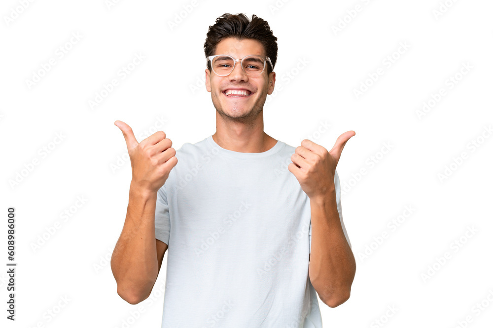 Young caucasian handsome man over isolated background with thumbs up gesture and smiling Young caucasian handsome man over isolated background with thumbs up gesture and smiling