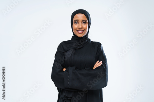 Beautiful arab middle-eastern woman with traditional abaya in studio photo