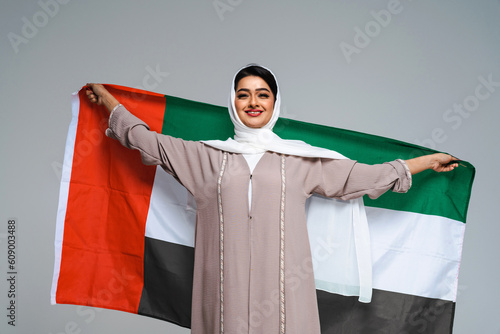 Beautiful arab middle-eastern woman with traditional abaya in studio