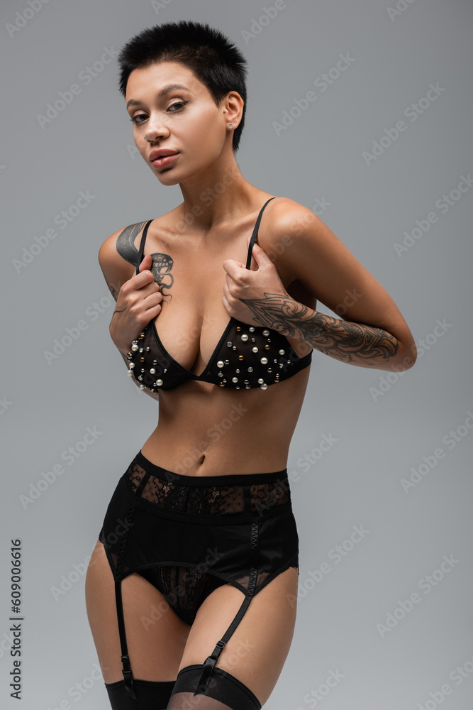 Sensual lady posing in panties stockings and bra - Stock Photo