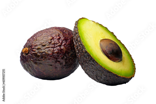 Two Hass avocados next to each other. One whole avocado and a cut avocado on the right with a stone inside, isolated studio shot on white background photo