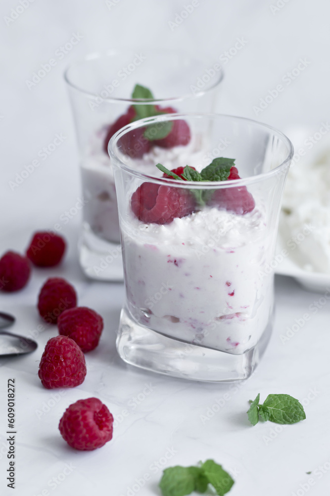 Yogurt and raspberry dessert. Deliciously. On a white background Yogurt and raspberry dessert. Deliciously. On a white background