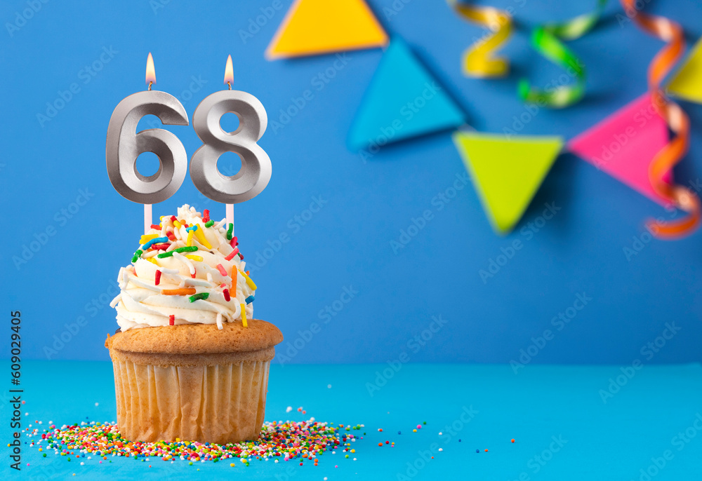 Birthday cake with candle number 68 - Blue background