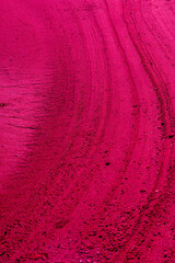 Acrylglasbilder Pantone 2023 Viva Magenta Surreal background of red, viva magenta streaks in the sand. Texture.   © Studio Eli