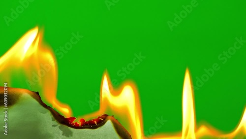 Fire flame burning paper on green screen background