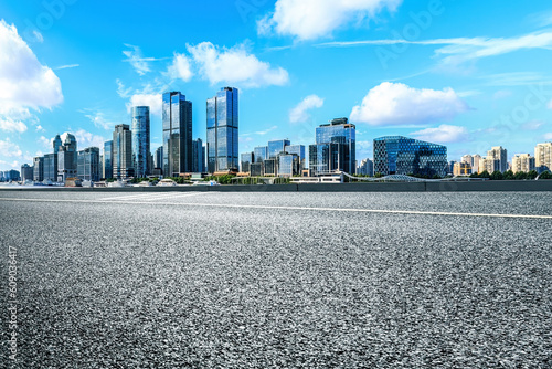 Clean asphalt road and city skyline in Shanghai