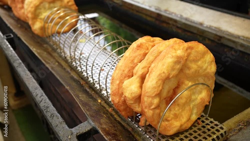Preparing hungarian langos at a street food vendor food truck
