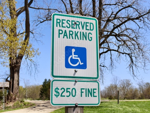 A close view of the reserved parking handicap sign.