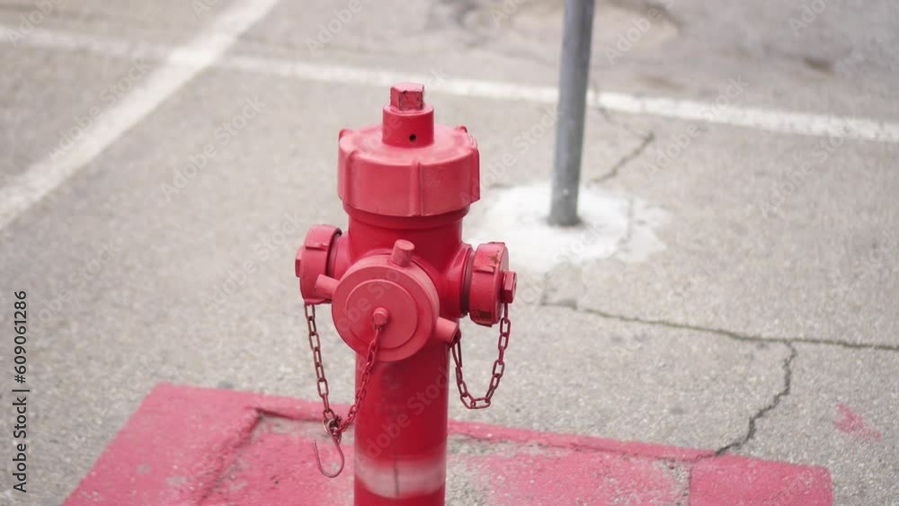 Red fire hydrant on the street parking Red fire hydrant on the street parking