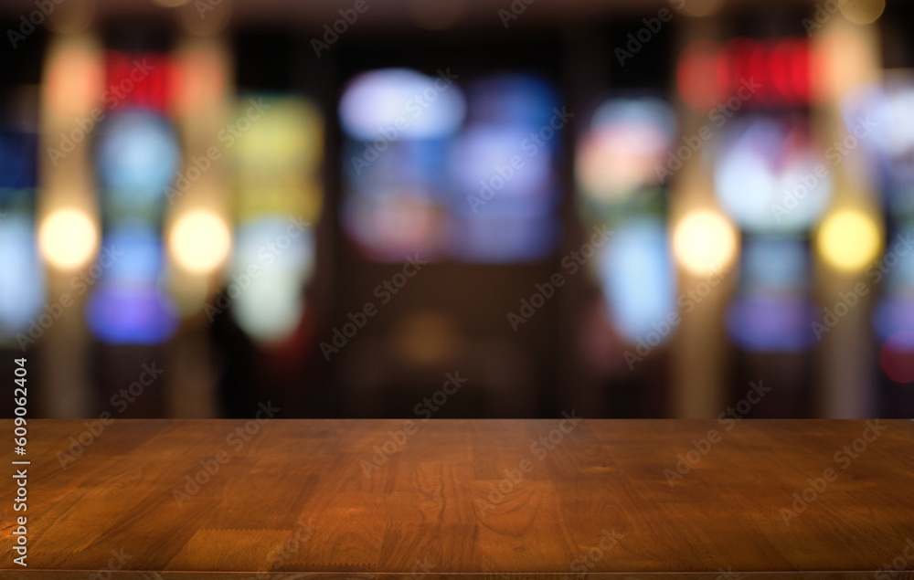 Empty wood table top and blur of night market background/selective focus .For montage product display. Empty wood table top and blur of night market background/selective focus .For montage product display.