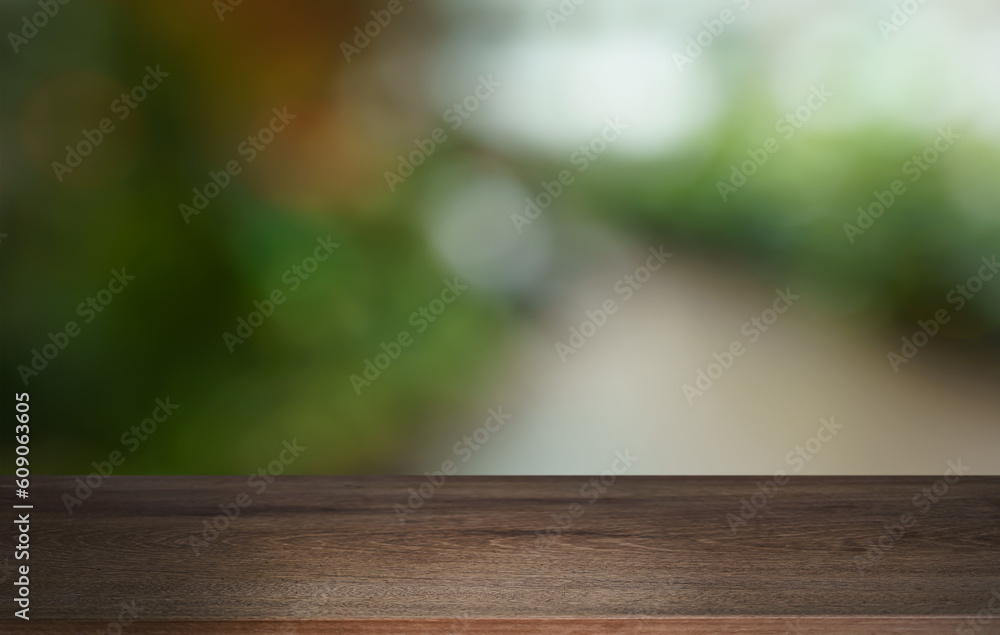 Empty wood table top and blur of out door garden background Empty wooden table space for text marketing promotion. blank wood table copy space for background Empty wood table top and blur of out door garden background Empty wooden table space for text marketing promotion. blank wood table copy space for background