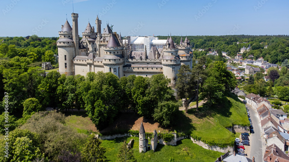 Aerial view of the Castle of Pierrefonds in the forest of CompiÃ¨gne, Picardy, France - Medieval castle restored by the French architect EugÃ¨ne Viollet-le-Duc in the 19th Century