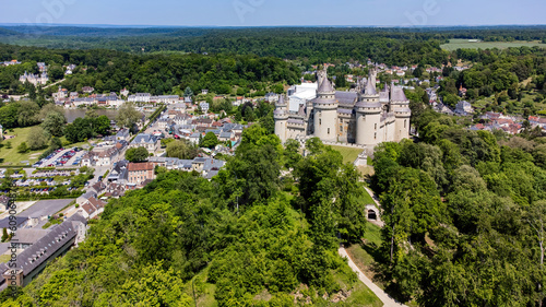 Aerial view of the Castle of Pierrefonds in the forest of CompiÃ¨gne, Picardy, France - Medieval castle restored by the French architect EugÃ¨ne Viollet-le-Duc in the 19th Century photo