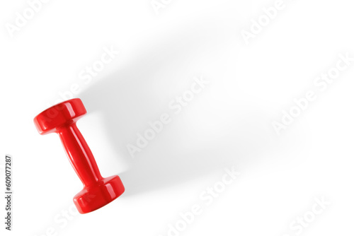A red dumbbell with bright highlights casts a long shadow on the background. Isolated on a transparent background. View from above.