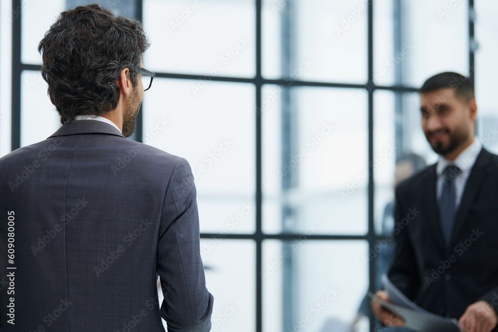 High angle of one young caucasian businessman from the back High angle of one young caucasian businessman from the back
