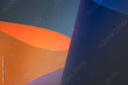 Abstract background made of bent colored paper. Soft light subtle texture. Copy space, wallpaper, backdrop. 
