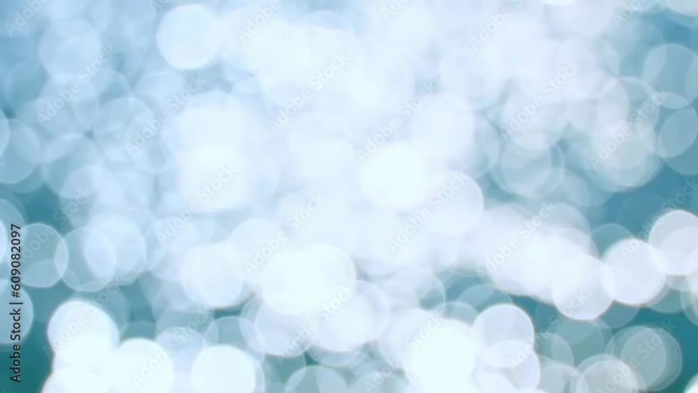 Blue glare on sea water or ocean. Sun glare and light leaks on lake water surface at sunset, white texture. Bokeh background with blurry green reflection. Water treatment and drinking water. Blue glare on sea water or ocean. Sun glare and light leaks on lake water surface at sunset, white texture. Bokeh background with blurry green reflection. Water treatment and drinking water.
