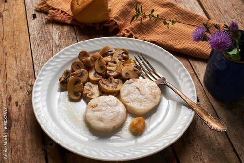 Hake slices with mushrooms