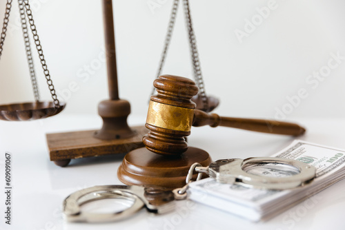 handcuffs and wooden mallet legal lawyer crime and violence concept.