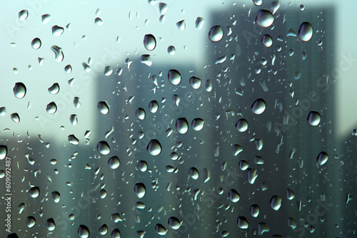 Rain. Raindrops on the window. Rainy day. Blue tone. Drops of water on the glass. Background of drops of water rain on glass transparent. Typhoon Lan. Japan. Osaka. Hamamatsu. Tokyo. Hiroshima.